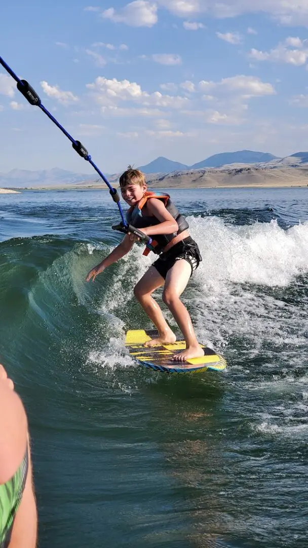 A person on a surfboard in the water.