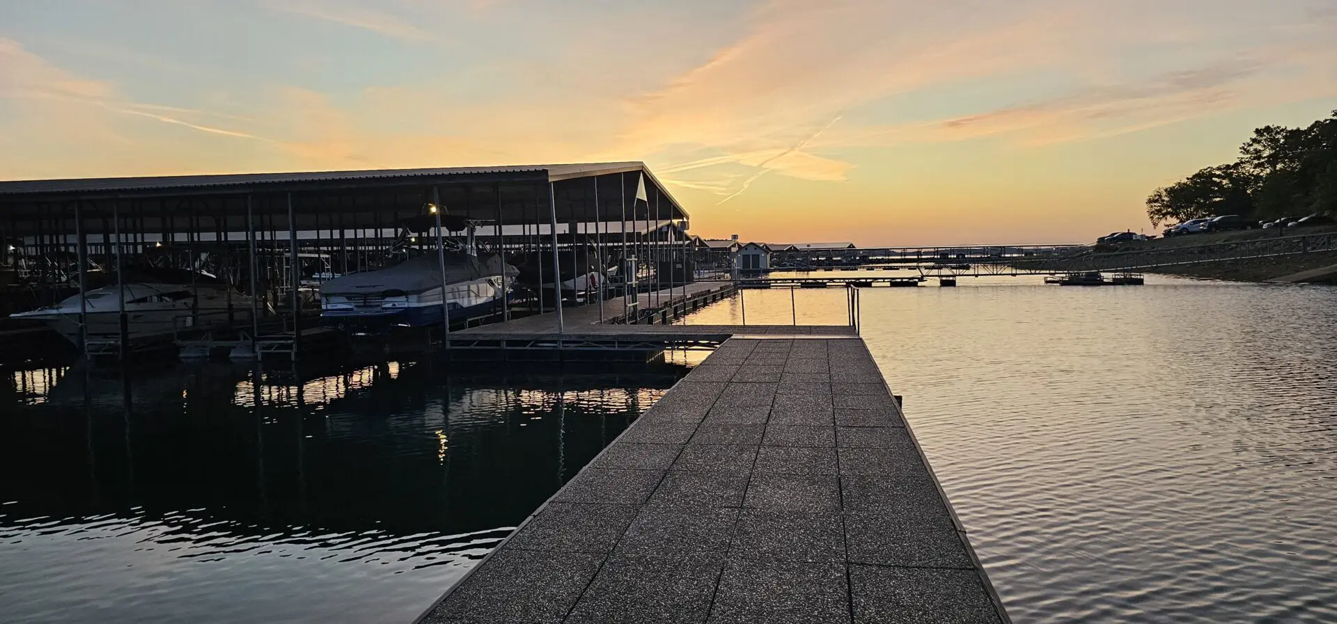 A dock with several boats docked in it.