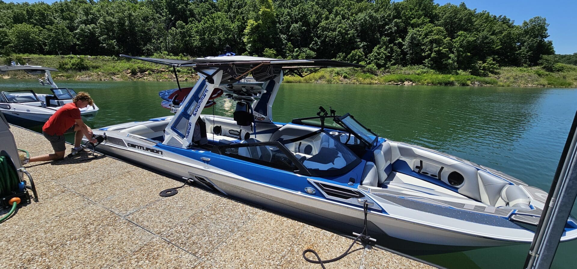 A boat with a helicopter attached to it.