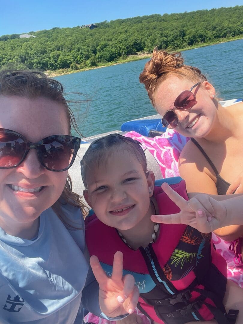 A family is taking a picture on the boat.