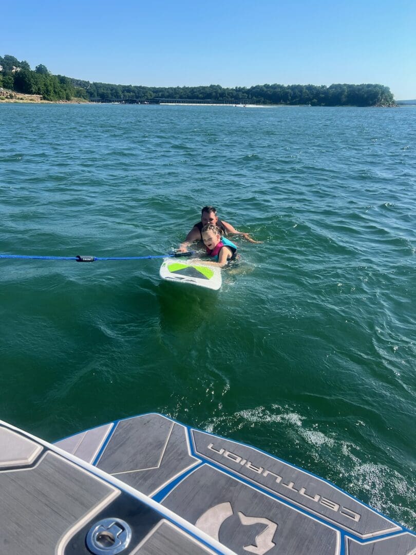 A person on a surfboard in the water.